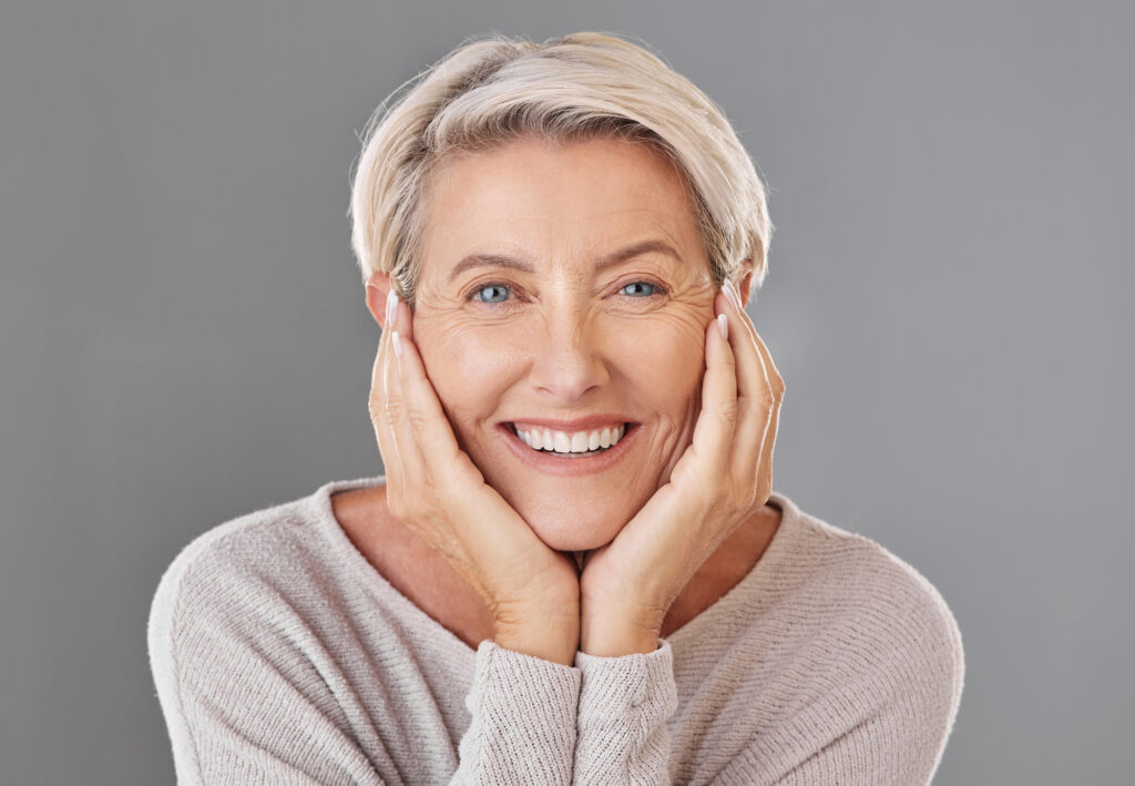 Middle aged woman showing off straight healthy smile. 