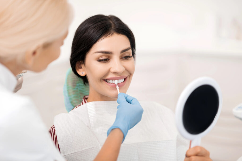 Woman having veneer replaced