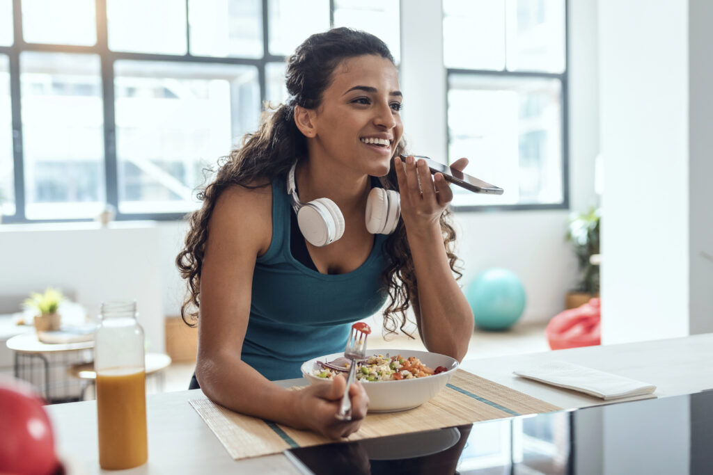 Young woman eating gluten-free salad. 